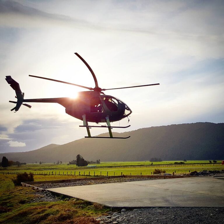 Helicopter lifting off at sunset on a Scott Jon workshop