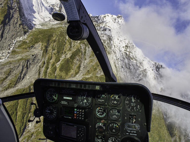 Scott Jon flying in a helicopter over New Zealand's Southern Alps