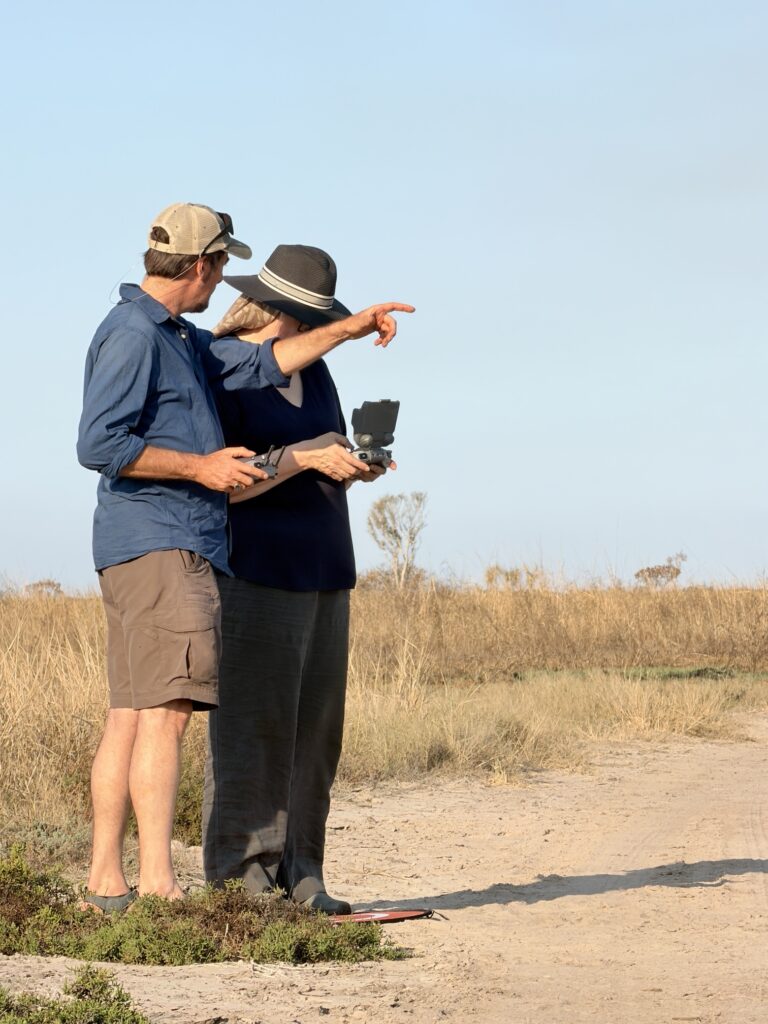 A guest flying a drone with a little guidance on a Kimberley track