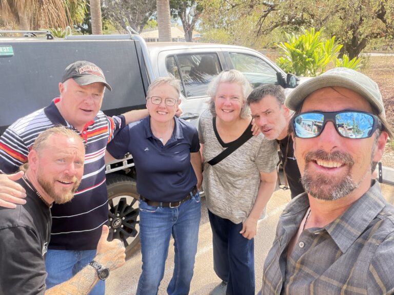 The workshop group together for a selfie beside the ute